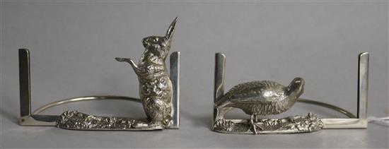 A pair of Edwardian silver novelty game mounted menu holders, Grey & Co, Birmingham, 1902, height 46mm.